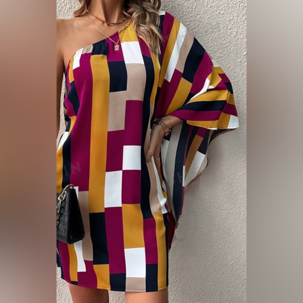 Woman’s Off The Shoulder Tunic Top